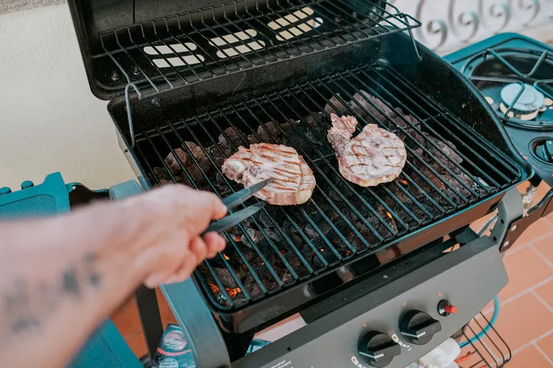 Close-up of two steaks grilled on a barbecue in Sardegna, Italy